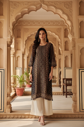Model with ivory trousers and chandelier earrings