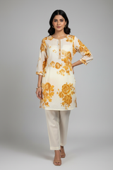 Model in golden kurta set in studio minimal jewelry