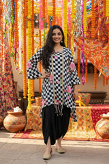 Model standing in elegant pose with flats
