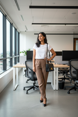 Model wearing brown linen pants in professional setting